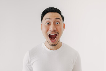 Funny shocked and surprised face of Asian man isolated on white background.