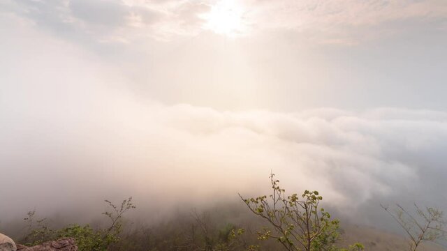 Timelapse clouds moving fast in during sunrise. view of fog flowing from the top of a mountain, Khao Phra Ya Dern Thong View Point Lopburi Thailand