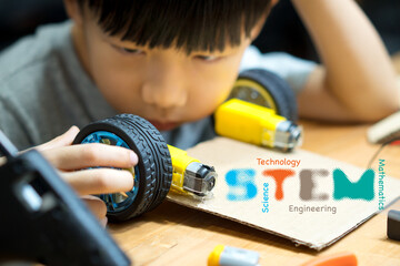 Science, Technology, Engineering and Mathematics (STEM) education concept. Closeup of an adorable...