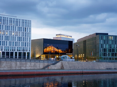 Futurium exhibition venue modern building exterior on a bank of Spree river in Berlin, Germany on a spring evening