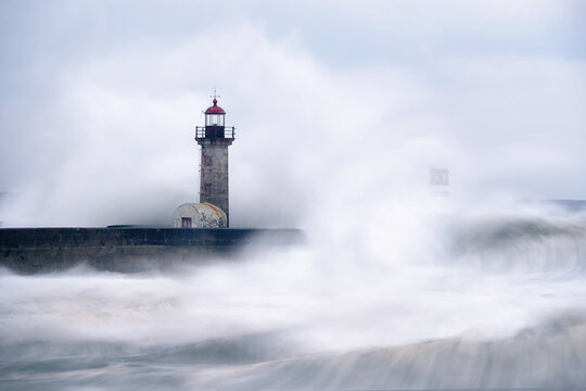 Wave crashing on lighthouse, long exposure 