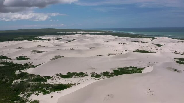 Aerial View Of Rolling Sand Dunes Of Brandfontein Rietfontein Private Nature. Follow Shot