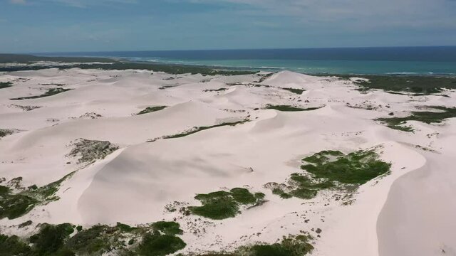 Aerial Over Rolling Sand Dunes Of Brandfontein Rietfontein Private Nature. Follow Shot