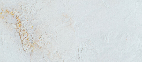 Beautiful white background of decorative plaster with yellow veins. 