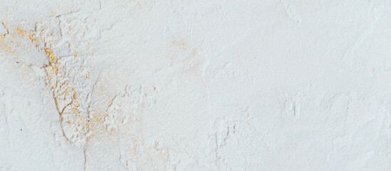 Beautiful white background of decorative plaster with yellow veins. 