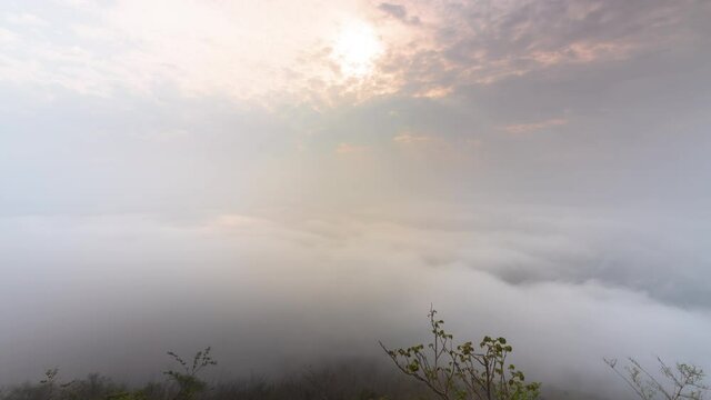 Timelapse clouds moving fast in during sunrise. view of fog flowing from the top of a mountain, Khao Phra Ya Dern Thong View Point Lopburi Thailand