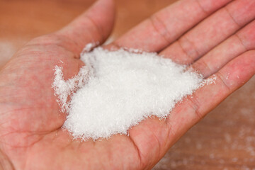 Monosodium glutamate on hand, MSG for food seasoning