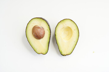 Organic fresh green avocado white background