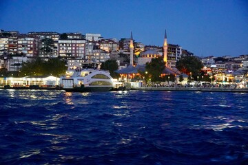 Fototapeta premium Night Panoramic view of the Istanbul waterfront from Golden Horn. Beautiful cityscape of Istanbul with old Galata Tower in the summer.