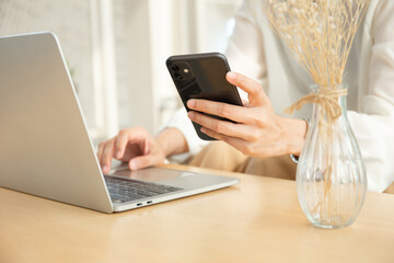 woman work using texting cell phone typing computer.student study education online learning.adult professional chatting on laptop,mobile contact us at Thinking business plan.connecting people concept