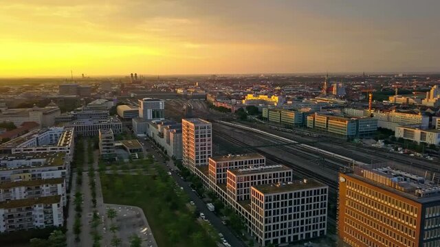 Munich in the first sunlight at a beautiful morning, 360 degrees panning shot in the inner city of the bavarian metropole under the bright, yellow sun.