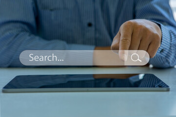 Businessman using tablet searching Browsing Internet Data Information.Networking Concept