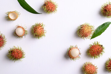 Ripe rambutan fruit pattern on white, Flat lay background, Rambutan is tropical fruit and native Southeast Asia, juicy and sweet taste