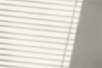 Background with window blinds shadow during golden hour
