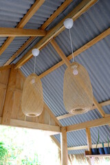 Fototapeta na wymiar Beautiful wooden geometric ceiling lamp interior contemporary