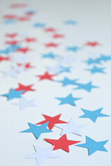 Background of five-pointed stars of the color of the usa flag, red, blue, white