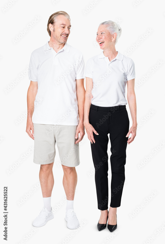 Poster Happy senior couple in white polo shirts with design space studio portrait full body