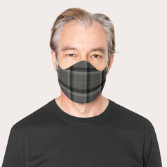 Mature man wearing plaid face mask in the new normal