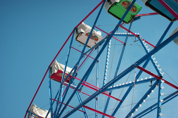 Closed Ferris wheel with blue sky