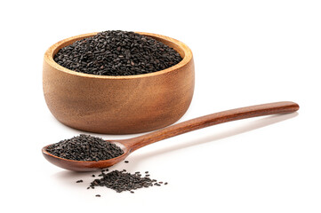  Black sesame seeds in wooden bowl and spoon isolated on white background.