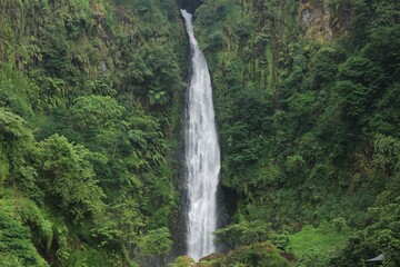 beautiful clear river and waterfall flow in tropical forest. Very romantic and freshness