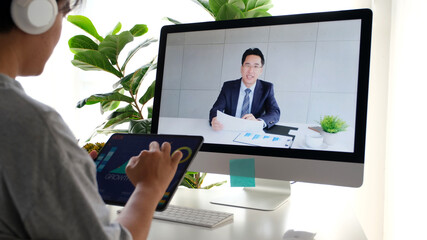 Video conference, Work from home, Asian woman holding business chart while making video call to business team with virtual web, Contacting colleague by conference on computer at home