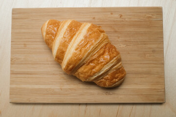 French croissant for breakfast in the morning and nature sunlight