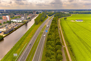Highway in between a canal and the countryside