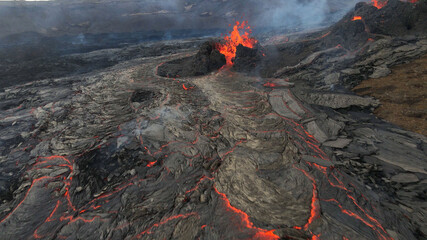 lava eruption volcano with snowy mountains, Aerial view
Hot lava and magma coming out of the...