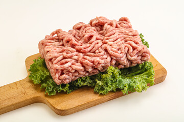 Raw pork minced meat over board