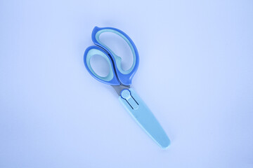 A pair of blue craft scissors for kids
