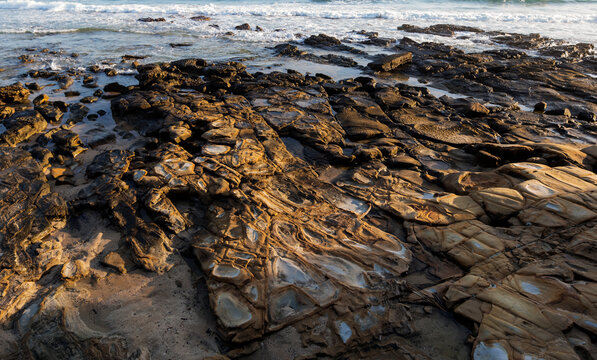 Early Morning Light On Rocks And Waves At Alexandra Parade Beach