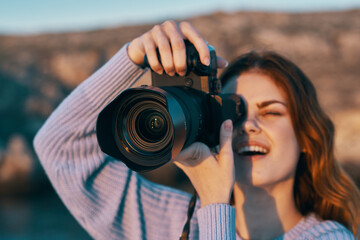 happy woman photographer outdoors in mountains professional landscape model