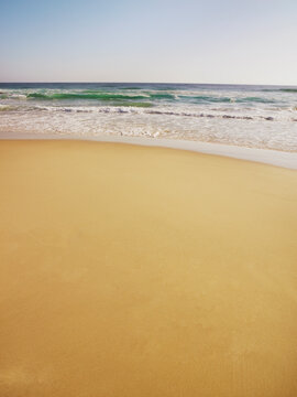 Waves rolling onto sand