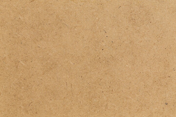 Pressed beige chipboard texture.