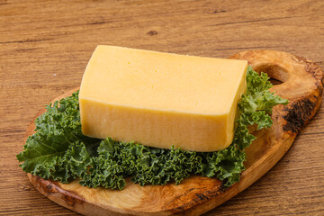 Tasty yelloow Tilsiter cheese brick