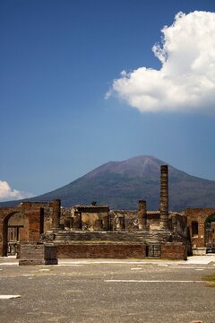 Pompeii, Italy, June 26, 2020 ancient Roman city
found after excavations following the eruption of the volcano Vesuvius in 79 AD.
view of the main square with ancient columns and the Vesuvius volcano 