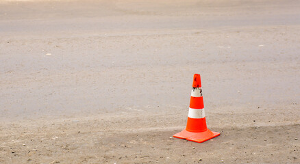 Red orange cone on the road - selective focus