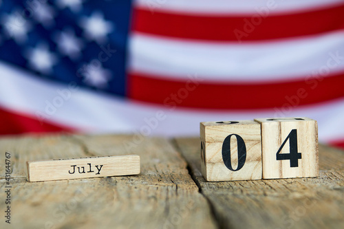 Wooden calendar with date on the background of the USA flag. Template for writing the dates of the national holidays of America with free text space. Independence of United State of America