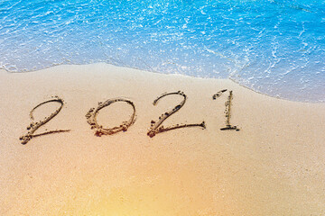 Happy New Year 2021 is coming concept sandy tropical ocean beach lettering