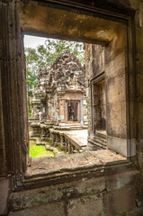 Fototapeta na wymiar Ancient buddhist khmer temple in Angkor Wat, Cambodia. Thommanon Prasat
