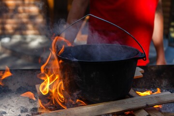 Bowler cooking food bonfire cauldron,  pot.