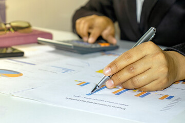 Business people reviewing reports, financial documents for analysis of financial information, work concept.