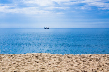 Water surface with Deep Blue sea and clear sky clouds. Landscape with Ocean small waves water reflection. Illustration for tourism, website or advertisement. Andaman sea, Thailand.