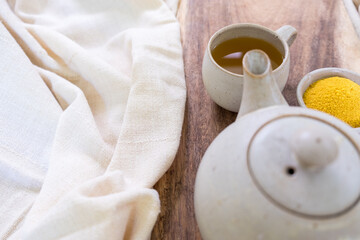 Fototapeta na wymiar Healthy yellow tea in ceramic ware 
