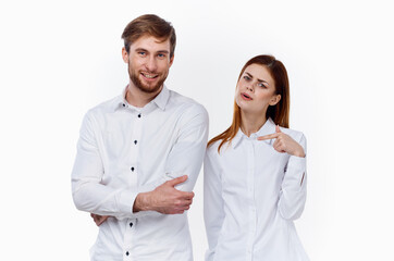 men and women in identical shirts on a light background gesticulate with their hands employees work partners