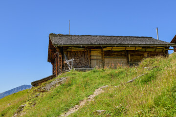Old wooden lodge on hiking trail above the Hasliberg in Switzerland