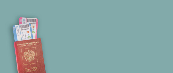 Banner with red Russian travel passport with flight boarding tickets isolated at solid background with copy space. Concept fast travel by airplanes.