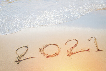 Happy New Year 2021 is coming concept sandy tropical ocean beach lettering
