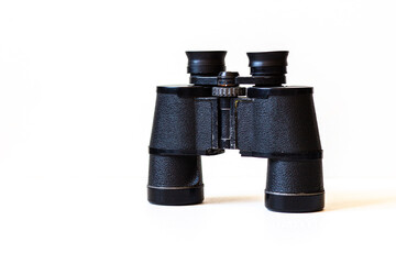 old black binoculars on white background